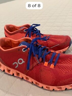 On Running Women’s Red and Blue Athletic Shoes
